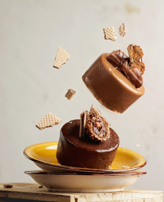 Chocolate and caramel glazed cakes tossed in a plate
